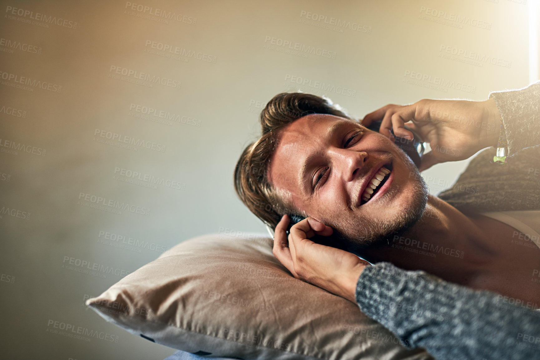 Buy stock photo Relax, headphones and portrait of man in bed for streaming, radio or podcast in morning. Technology, happy and music producer in home for audio, sound and sleep or meditation app for calm and zen