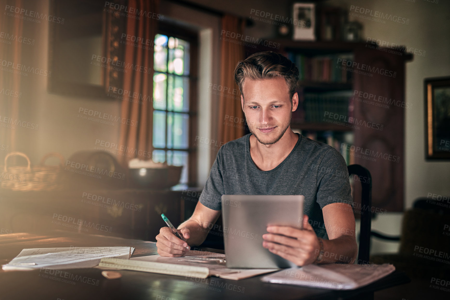 Buy stock photo College, night and student research with tablet or planning project with ebook, app or education info. Internet, library and man in university on elearning website writing to study books and reading