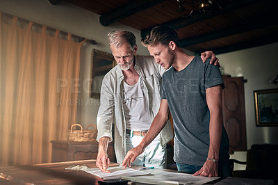 Buy stock photo Architect, elderly father and man with plans for home improvement, support and design in office. Senior apprentice, mentor and son at desk for creativity, brainstorming and help in family business