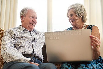 Buy stock photo Senior, couple and relax with laptop in house for watching movie, streaming film and bonding on retirement break. Happy, elderly people and digital with love for entertainment, subscription or lounge