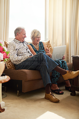 Buy stock photo Senior, relax and couple with laptop in house for watching movie, streaming film and bonding on retirement break. Happy, elderly people and digital with love for entertainment, subscription or lounge