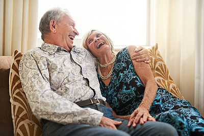 Buy stock photo Senior, couple and laughing at nursing home couch with love, smile and bonding in living room. Retirement, care and relax with elderly people on a sofa with marriage, support and joke together