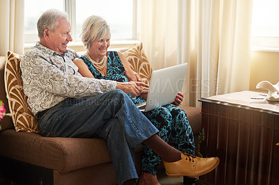 Buy stock photo Elderly, couple and love with laptop in house for watching movie, streaming film and bonding on retirement break. Happy, senior people and digital to relax for entertainment, subscription or lounge