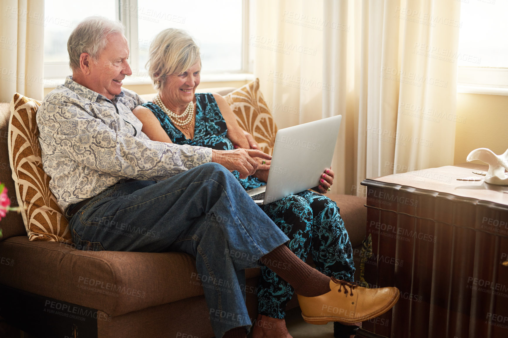 Buy stock photo Elderly, couple and love with laptop in house for watching movie, streaming film and bonding on retirement break. Happy, senior people and digital to relax for entertainment, subscription or lounge