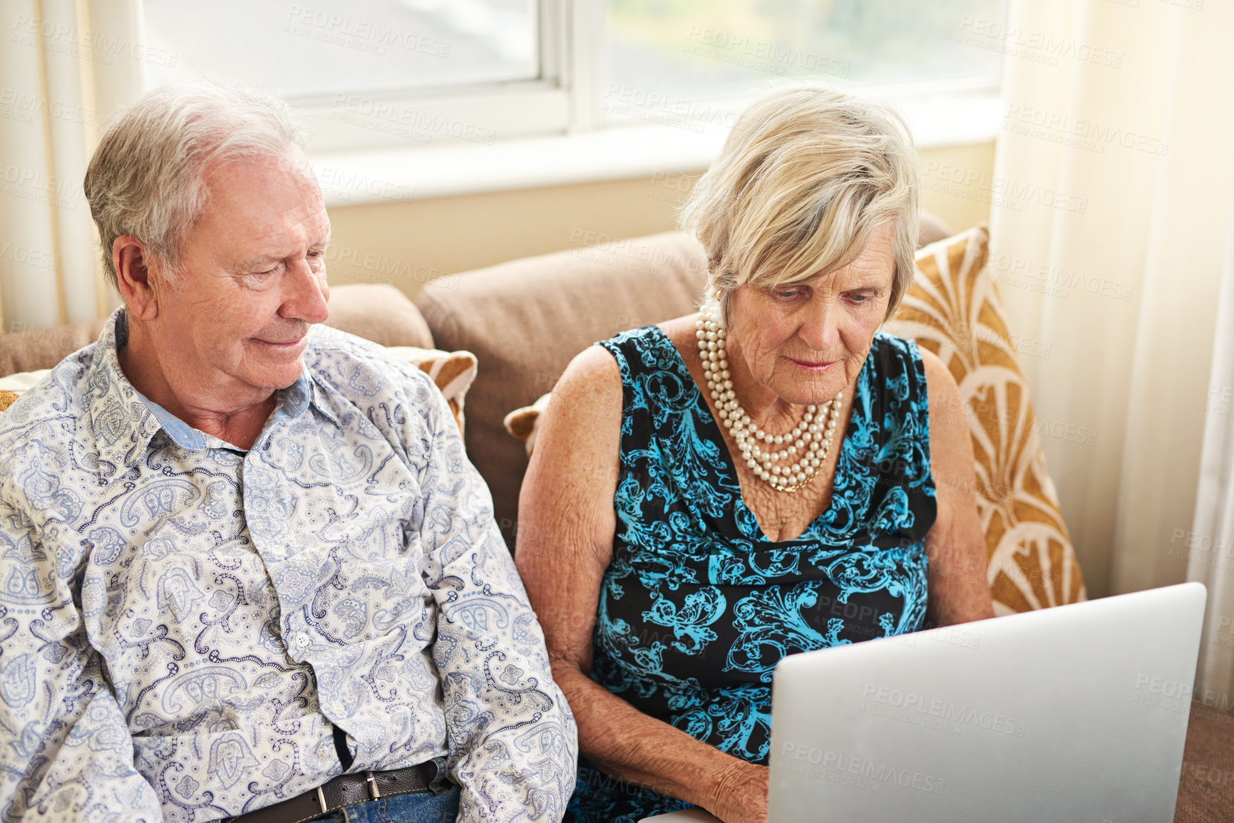 Buy stock photo Relax, senior and couple with laptop in house for watching movie, streaming film and bonding on retirement break. Elderly, people and digital with love for entertainment, subscription or lounge