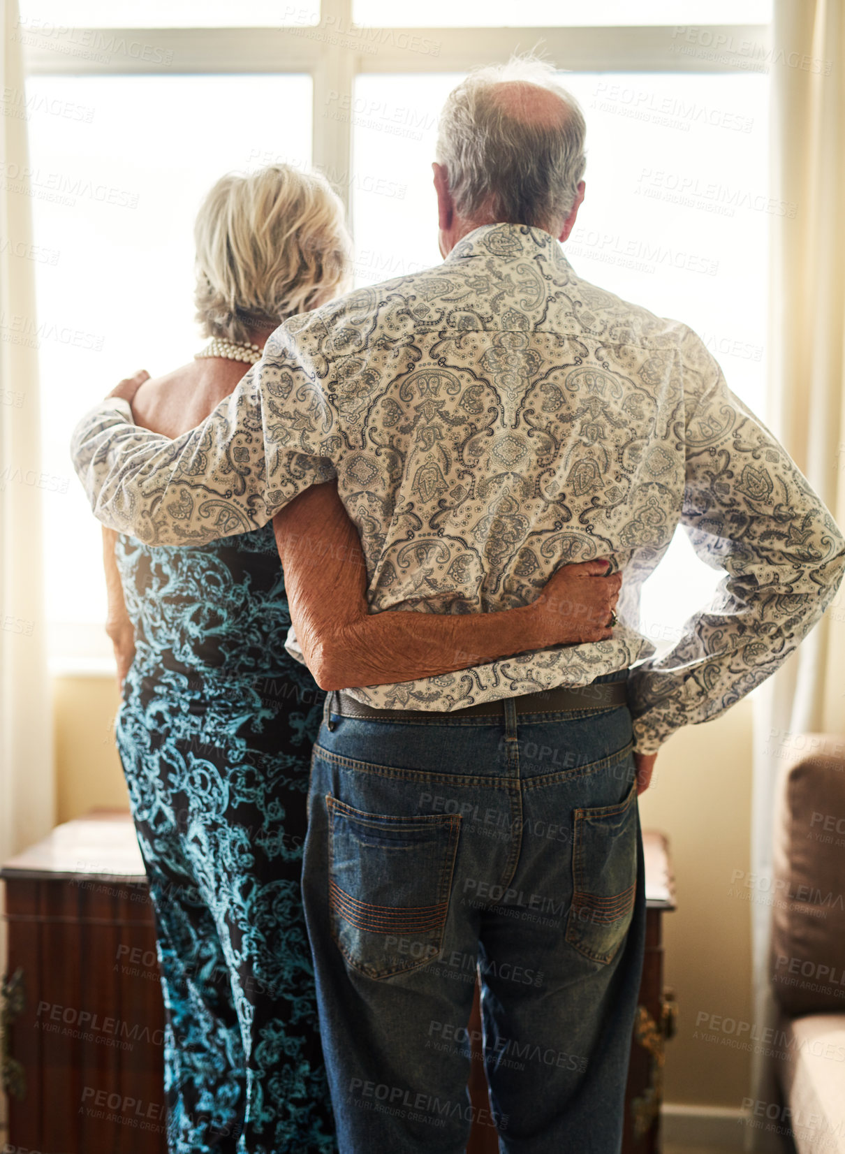 Buy stock photo Senior couple, hug and support in home, relax and unity together in living room. Solidarity, love and married people for trust and help for bonding, man and female person in retirement house
