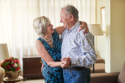 Buy stock photo Dance, love and music with elderly couple in living room of retirement home for bonding or security. Anniversary, fun or smile with senior man and woman in apartment together for safety or trust
