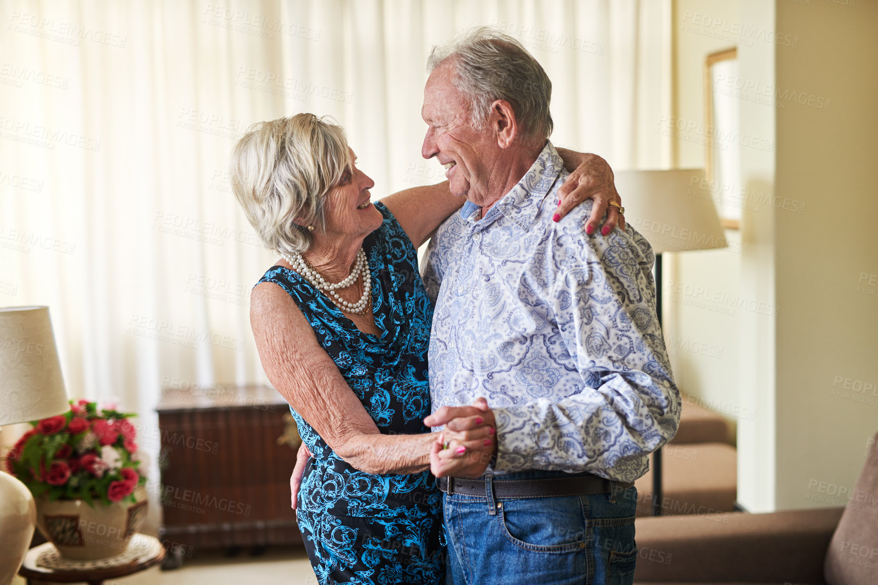 Buy stock photo Dance, love and music with elderly couple in living room of retirement home for bonding or security. Anniversary, fun or smile with senior man and woman in apartment together for safety or trust