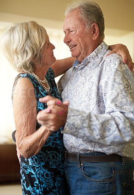 Buy stock photo Dance, fun and smile with elderly couple in living room of retirement home for bonding or security. Anniversary, love or music with senior man and woman in apartment together for safety or trust
