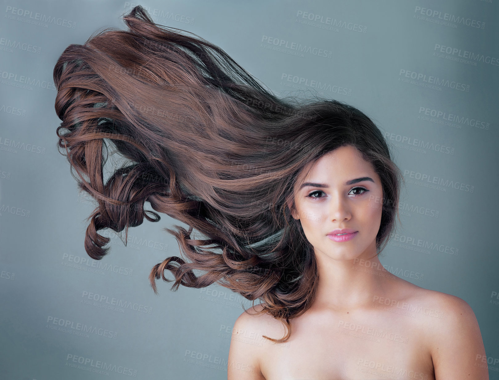 Buy stock photo Woman, studio or portrait with wave in hair care and makeup, aesthetics with facial glow. Female person, beauty transformation or cosmetics with blue background and mockup, highlights with movement