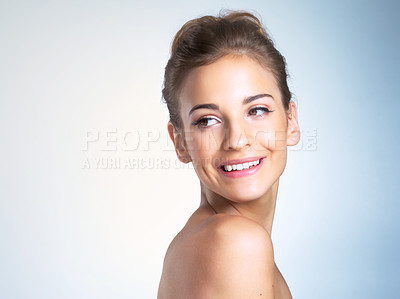 Buy stock photo Studio shot of a beautiful young woman looking over shoulder