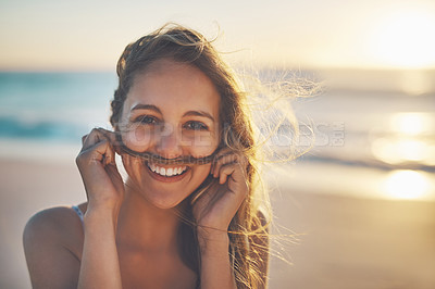 Buy stock photo Cropped shot of a woman playfully making a mustache with her hair