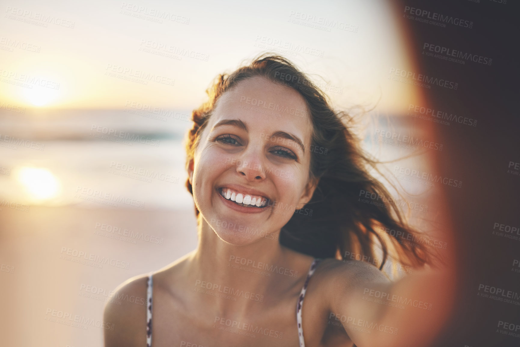 Buy stock photo Girl, portrait and selfie on beach with sunset for memory, profile picture update and travel blog influencer on holiday. Woman, person and happy at ocean with pov, summer vacation and content creator