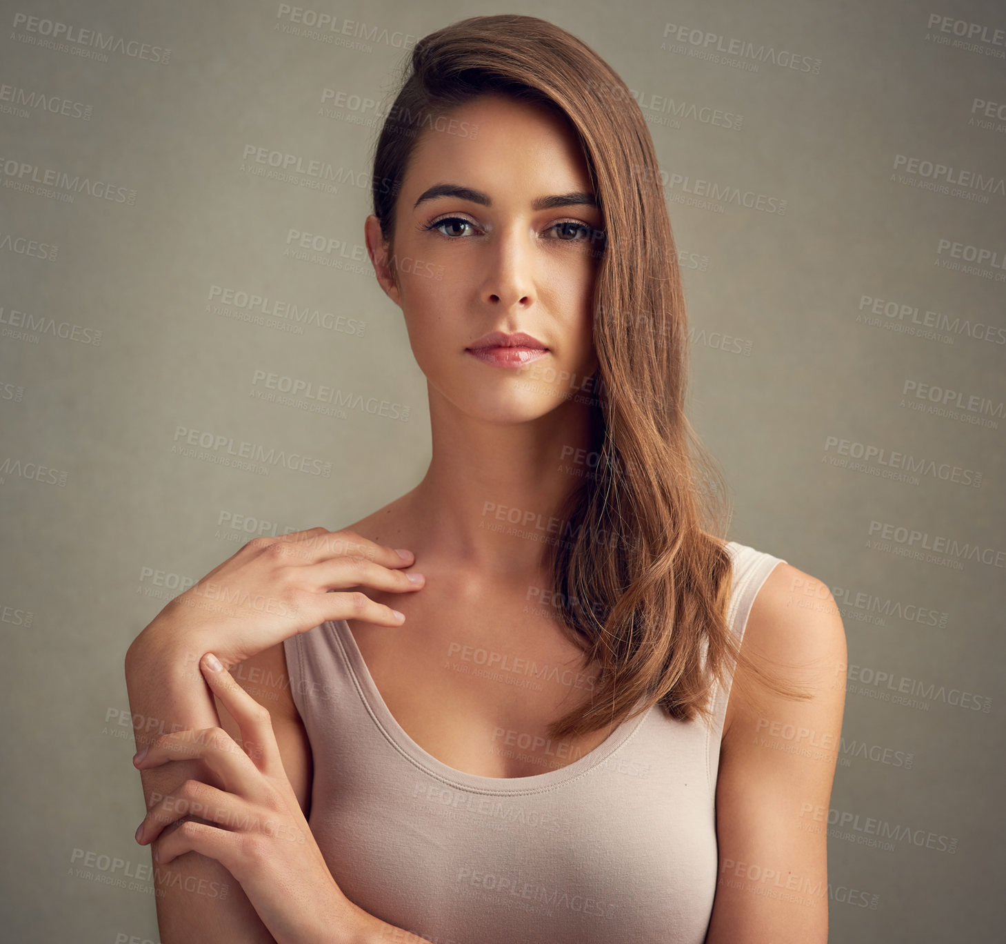 Buy stock photo Hair care, portrait and model in studio with cosmetics for keratin treatment, shampoo or shine on brown background. Beauty, aesthetic and woman for natural glow, satisfaction or healthy texture