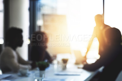 Buy stock photo Shot of a businessman giving a presentation to colleagues in a boardroom