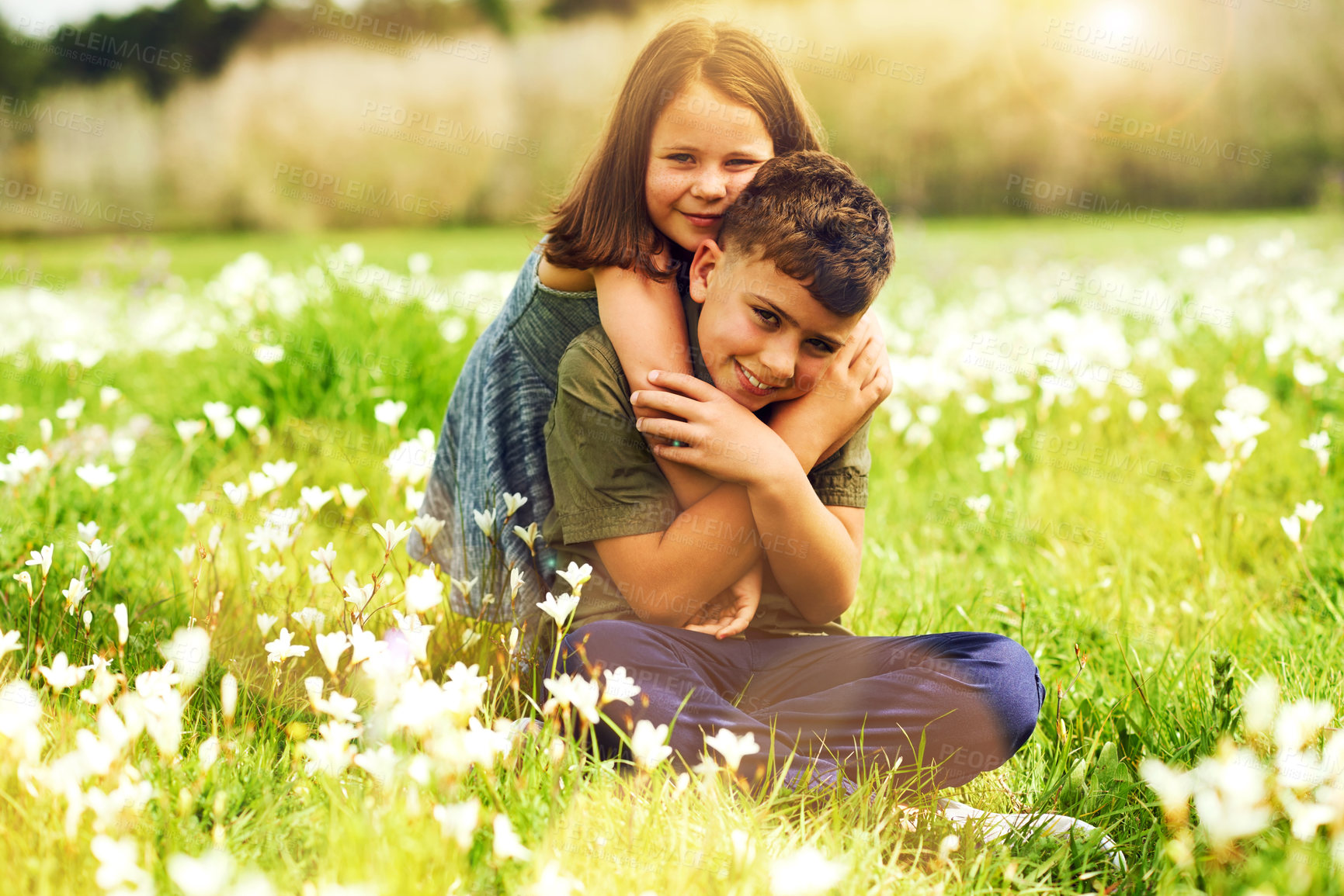 Buy stock photo Portrait, children and hug with smile in park together for support, bonding and playing in summer. Siblings, boy and girl in nature, garden and backyard for fun games as childhood development