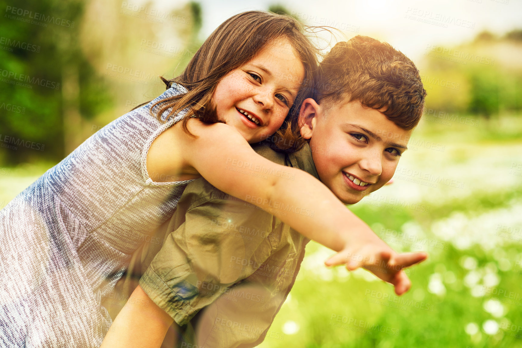 Buy stock photo Piggy back, field and portrait of kids outdoors for bonding, playing and fun together in nature. Family, childhood and happy girl and boy in meadow for laughing, adventure and relax on holiday