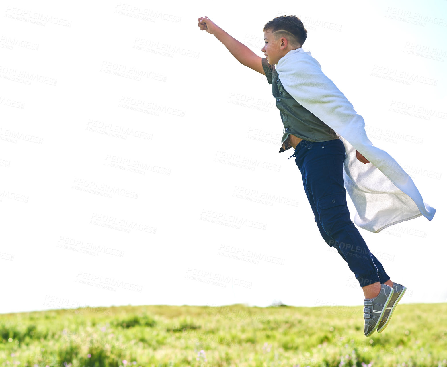 Buy stock photo Superhero, costume and child with flying in nature for fantasy play, imagination or save the world on field. Boy kid, person and jump with cape in park for cosplay, dress up or game with mockup space