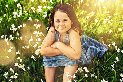 Buy stock photo Grass, girl and kid in portrait for relaxing, resting and enjoying outdoor in park. Nature, backyard and flowers in countryside with happy child on vacation, summer break and freedom with smile