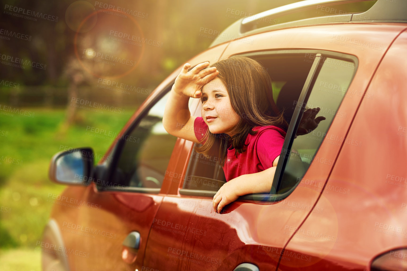 Buy stock photo Happy, car and window with kid for goodbye with salute, honor and greeting for leaving in nature. Girl scout, child and lens flare with hand gesture for pride, journey and driving in outdoor driveway