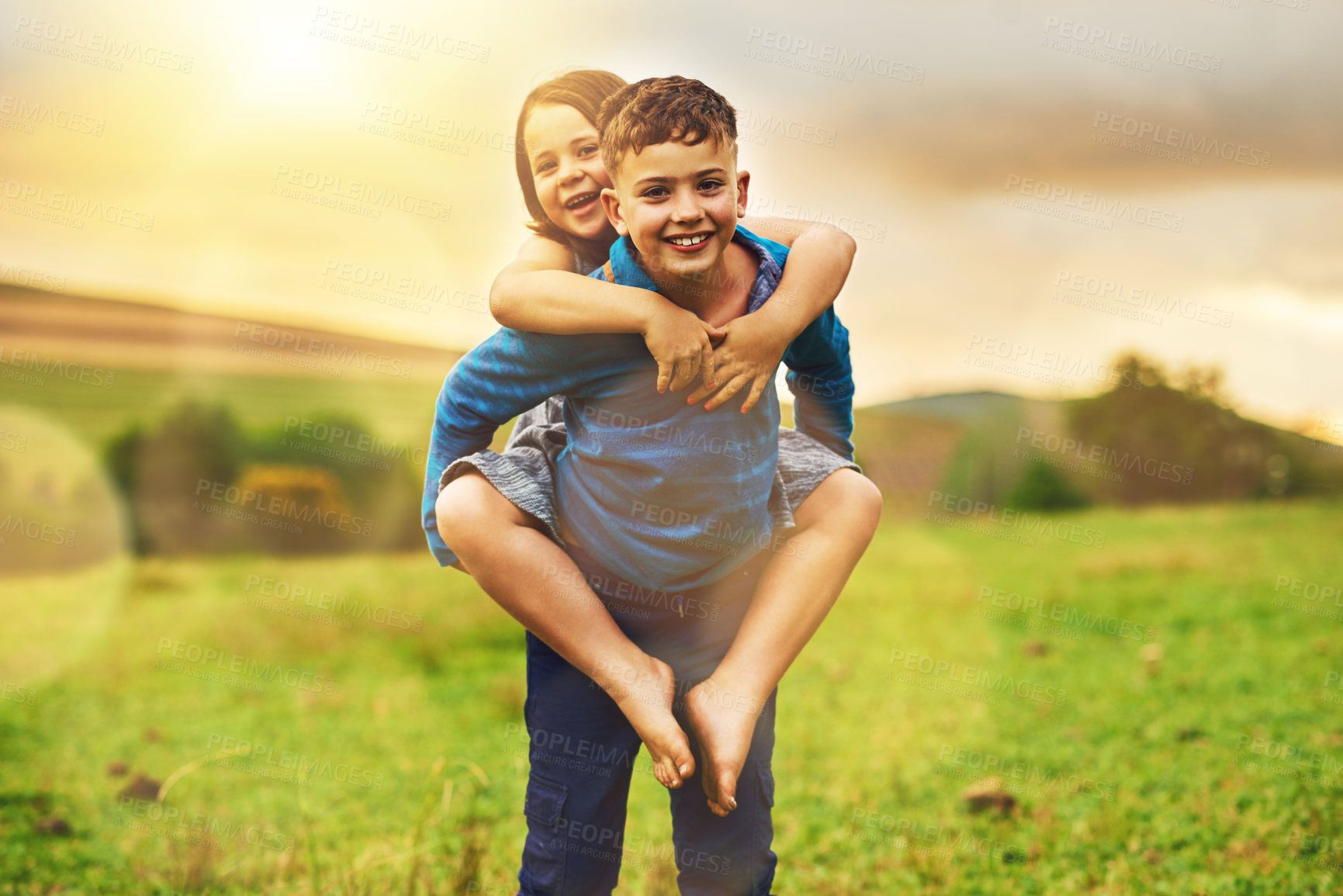 Buy stock photo Piggyback, nature and portrait of kids outdoors for bonding, playing games and fun together in field. Family, childhood and happy girl and boy in meadow for weekend, adventure and relax on holiday