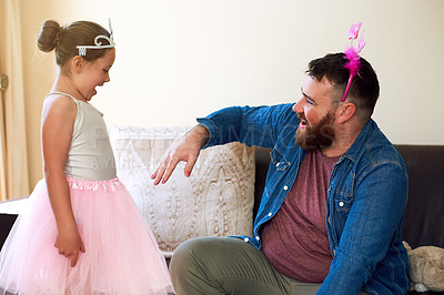 Buy stock photo Shot of an adorable little girl painting her father’s nails at home