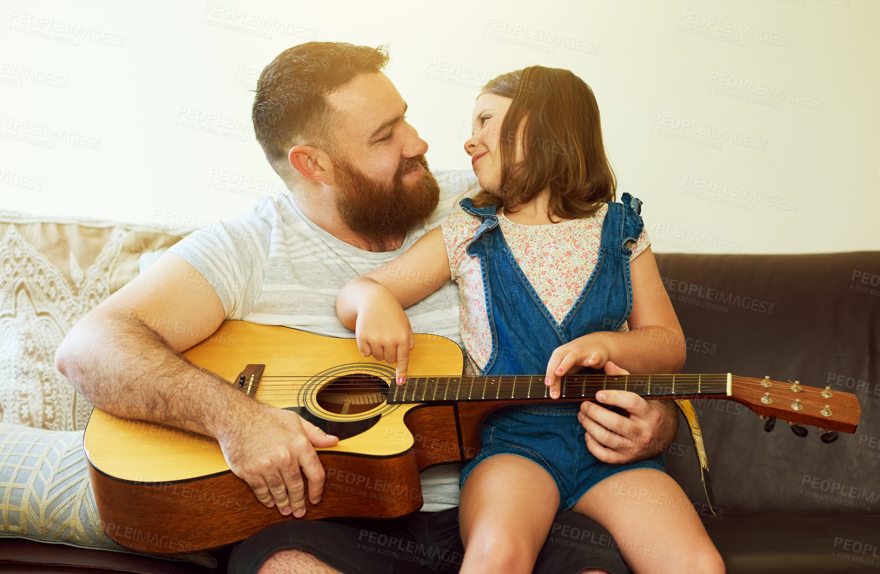 Buy stock photo Father, house and child with guitar on sofa, learning music and family bonding or teaching instrument in home. Weekend, childhood development and creative for knowledge, girl and playing together