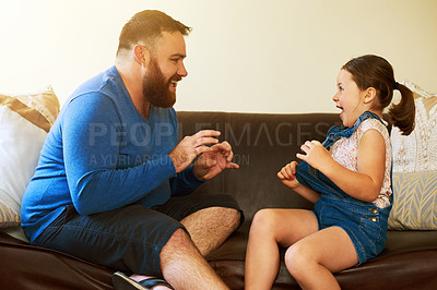 Buy stock photo Happy, playing and father with kid on sofa in home for bonding, relationship and relax together. Family, parenting and dad with girl for tickle, fun and laughing in living room on holiday or weekend