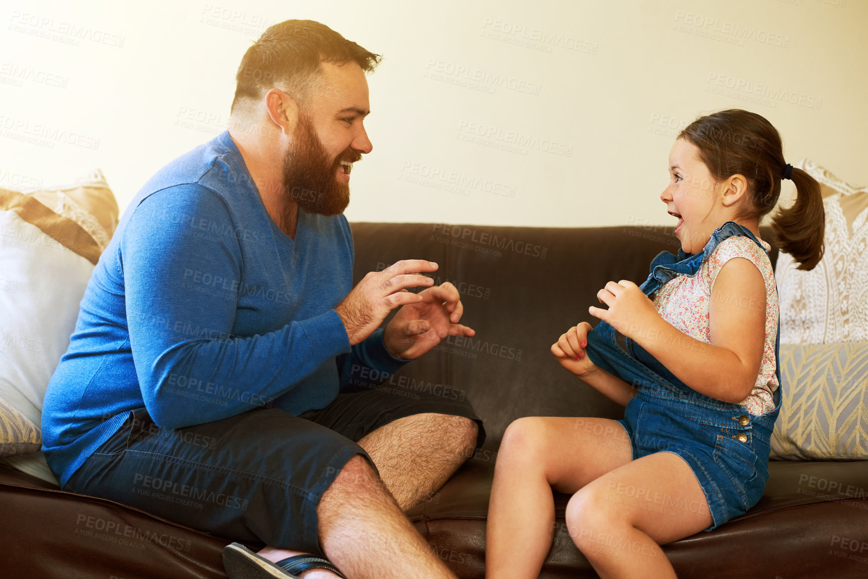 Buy stock photo Happy, playing and father with kid on sofa in home for bonding, relationship and relax together. Family, parenting and dad with girl for tickle, fun and laughing in living room on holiday or weekend