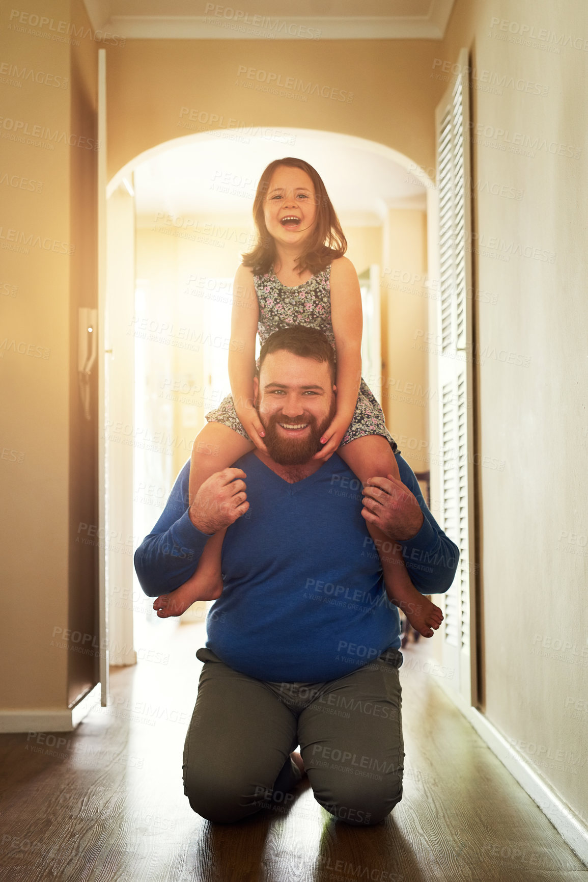 Buy stock photo Shot of an adorable little having fun with her father at home