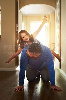 Buy stock photo Shot of an adorable little having fun with her father at home