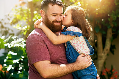 Buy stock photo Dad, kid and kiss in backyard with smile, hug and bonding on outdoor weekend with care. love and respect. Holiday, father and girl in garden together in support, trust or happy growth with embrace.