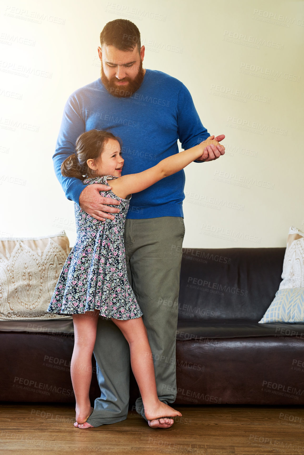 Buy stock photo Shot of an adorable little girl dancing with her father at home