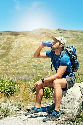 Buy stock photo Man, drinking water and backpack for hiking in nature with fitness adventure, break and relax to explore the environment. Hiker, person or trekking for body wellness, exercise and scenery with thirst