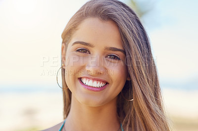 Buy stock photo Portrait of an attractive young woman standing outside on a sunny day