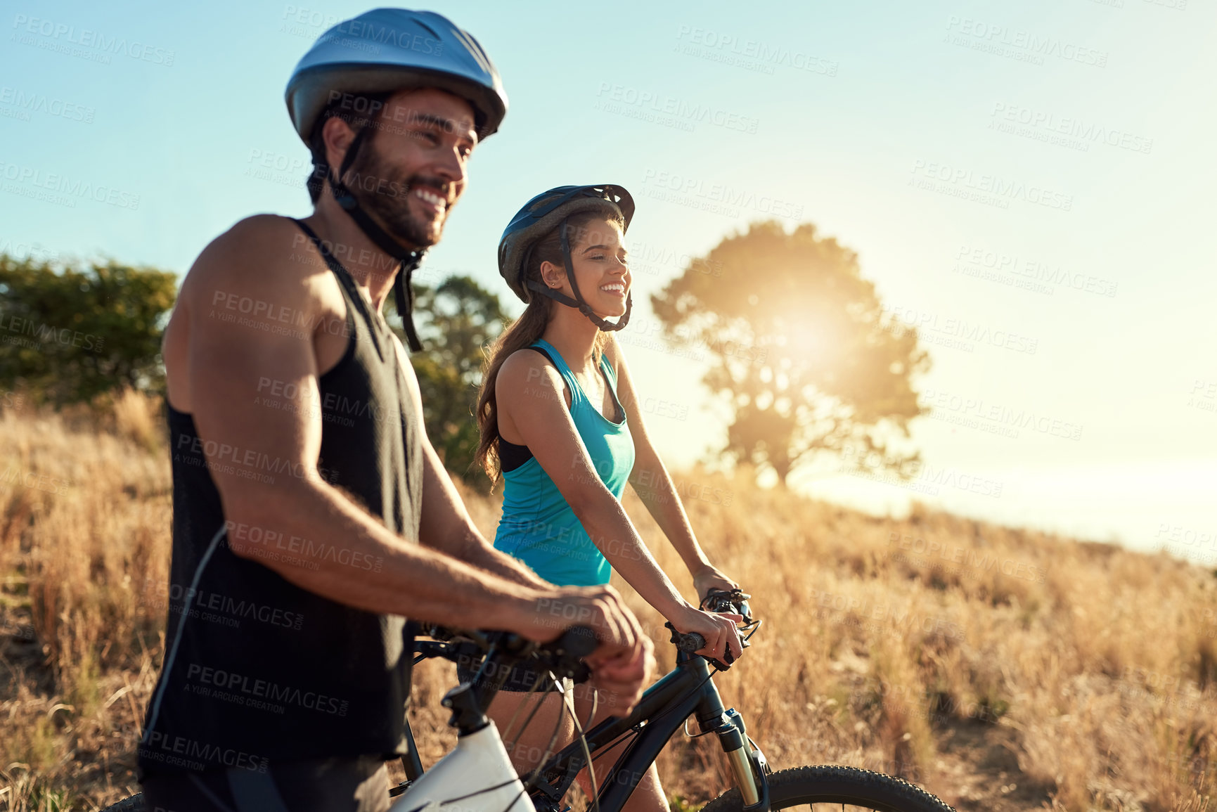 Buy stock photo Happy couple, nature and cycling in the mountains for fitness and exercise together. Bike, wellness and young people with outdoor adventure and sports training with happiness and freedom mockup
