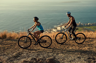 Buy stock photo Bike, mountains and couple with fitness, wellness and cardio with workout, time together and routine. Hobby, healthy man and woman with cycling, challenge or endurance with training, love and travel