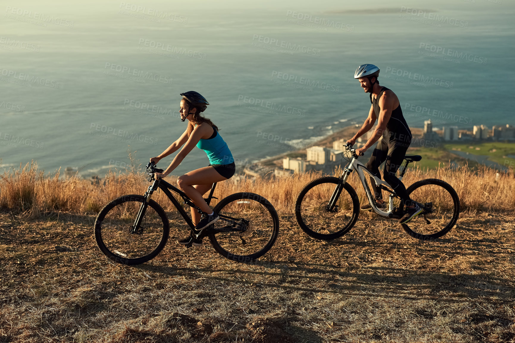 Buy stock photo Bike, mountains and couple with fitness, wellness and cardio with workout, time together and routine. Hobby, healthy man and woman with cycling, challenge or endurance with training, love and travel