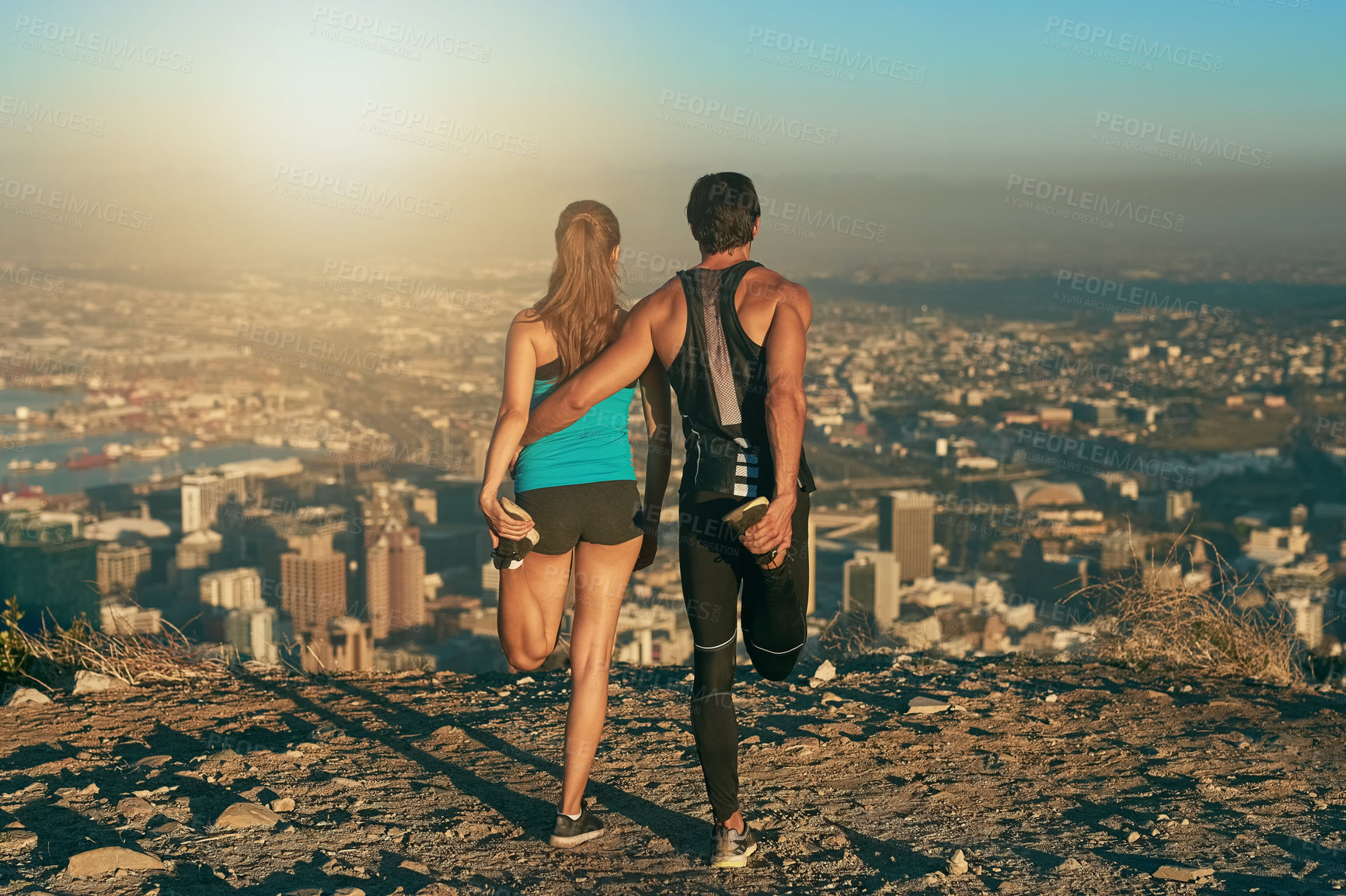 Buy stock photo Mountain, fitness and couple stretching together for morning workout, health and wellness from back. Warm up, man and woman getting ready for muscle exercise, marathon training and support at sunrise