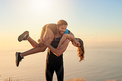 Buy stock photo Shot of a sporty couple being playful while out for a workout