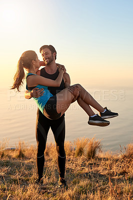 Buy stock photo Shot of an affectionate couple out for a workout