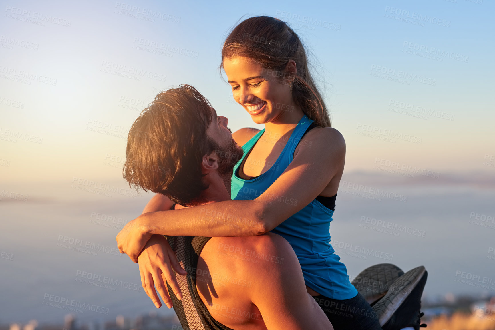 Buy stock photo Ocean, lift and couple with fitness, hug and energy with training, strong and workout. View, outdoor and healthy man with woman, embrace or exercise with relationship, motivation or nature with smile