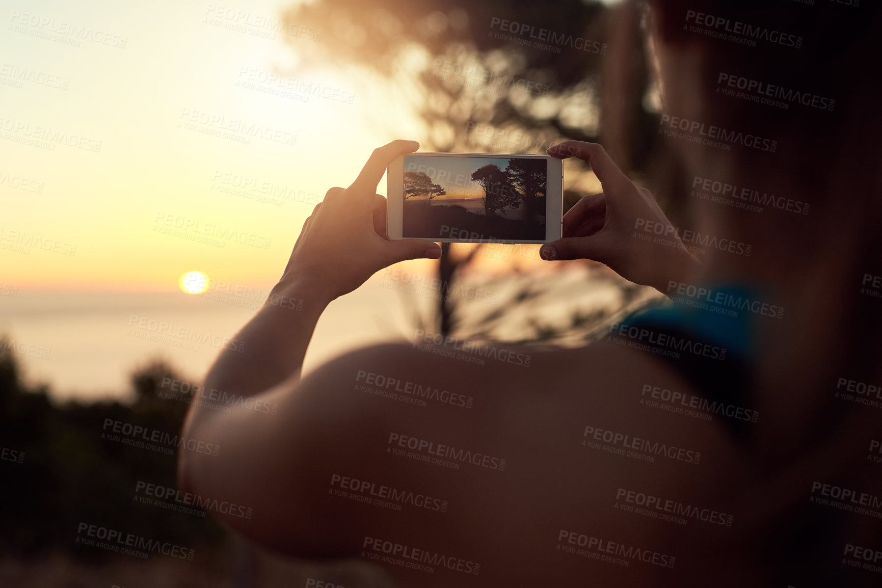 Buy stock photo Cropped shot of an unrecognizable woman taking photos with her cellphone