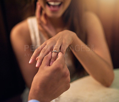 Buy stock photo Engagement, proposal and couple hands with ring in restaurant for celebration, wedding and marriage. Love, happy and man and woman with diamond jewelry on finger for date, commitment and romance