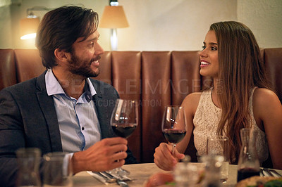 Buy stock photo Couple, valentines day and restaurant date with wine to celebrate love and happy communication. Young man and woman together for fine dining, drinks glass and romantic dinner for celebration night