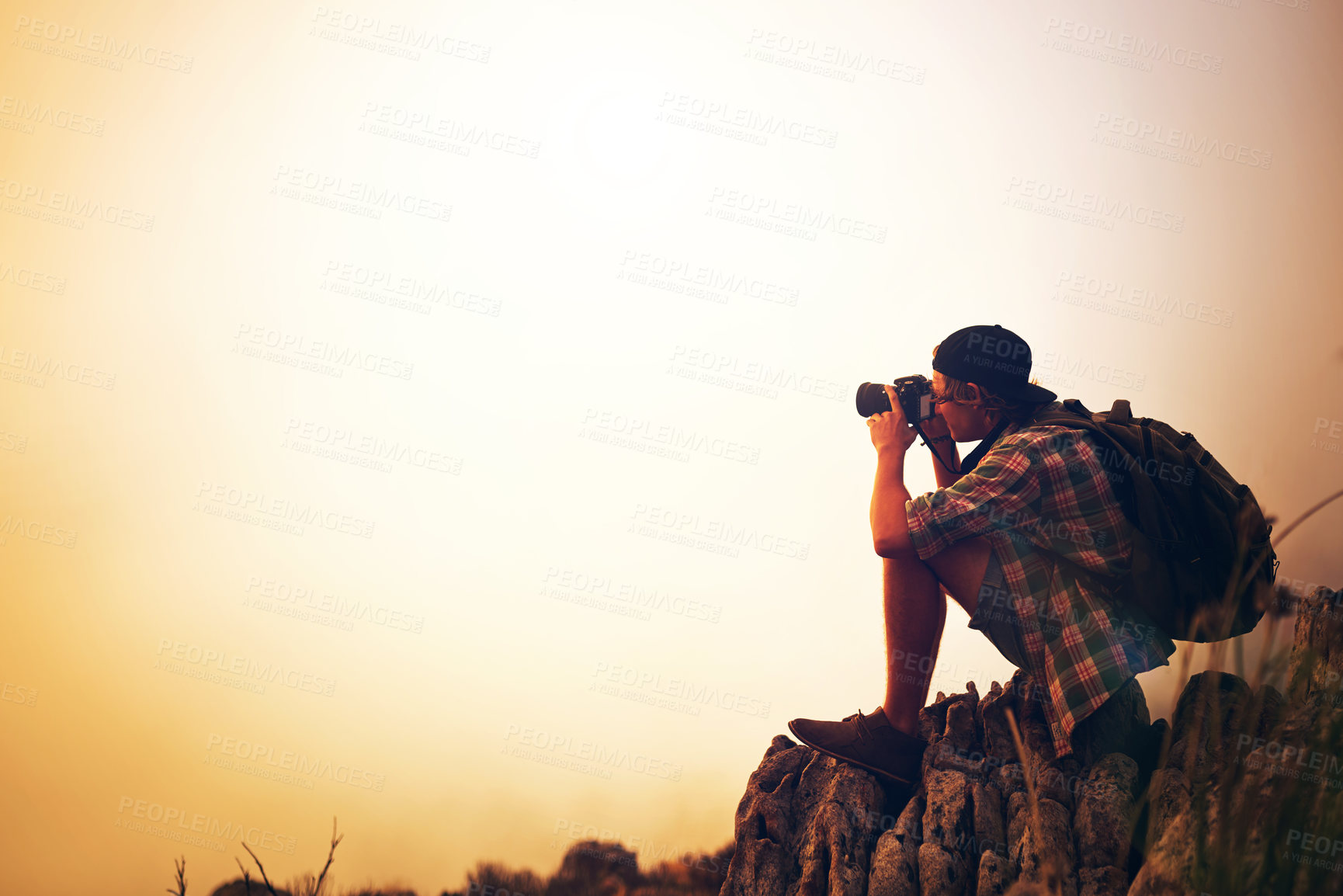 Buy stock photo Sunset, landscape photographer and man on mountain for picture on holiday, vacation and mockup space. Camera, photography and person at cliff outdoor for hiking, adventure and travel with view of fog