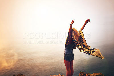 Buy stock photo Woman, freedom and hiking on mountain in morning with blanket, adventure and mockup at sunrise. Person, scenery and arms ups for trekking achievement, celebration and fitness goal on cliff in nature