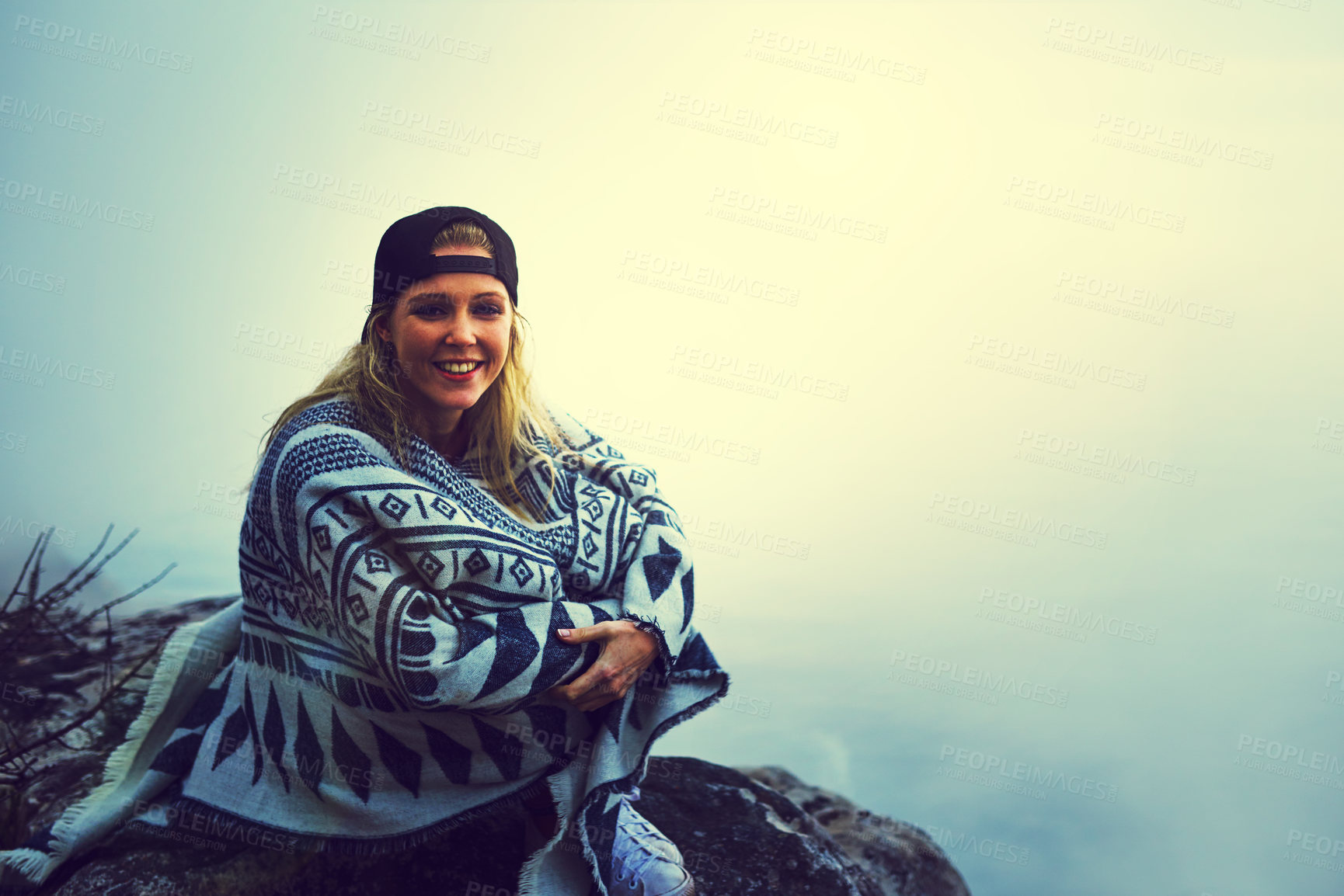 Buy stock photo Woman, hiking and portrait on mountain with fog, cap and mist for adventure, hobby and weekend. Female person, activity and sunrise in nature for travel, holiday or happiness with smile in morning