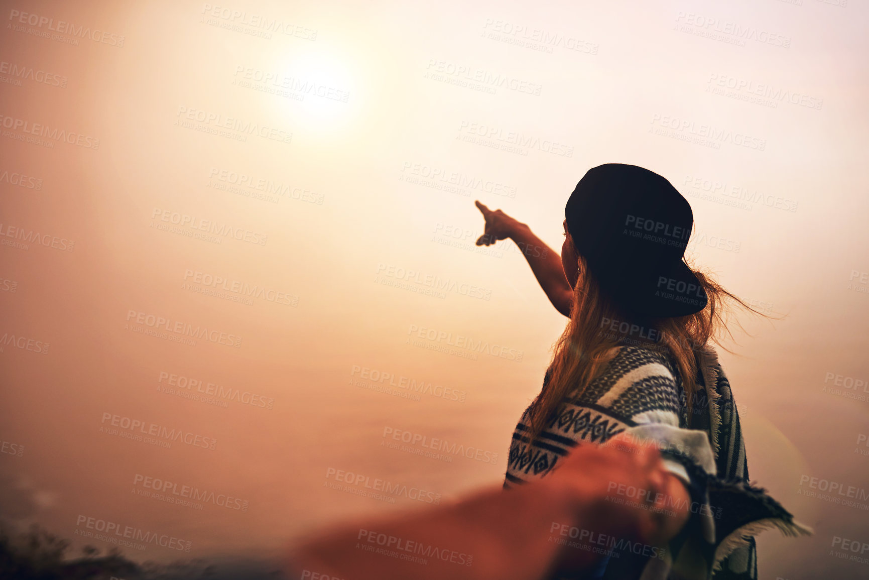 Buy stock photo Woman, hiking and sunrise on mountain with partner, cap and sun for adventure, hobby and weekend. Female person, activity and fog in nature for travel, holiday or landscape with pointing in morning