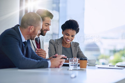 Buy stock photo Cropped shot of a group of businesspeople working together in an office
